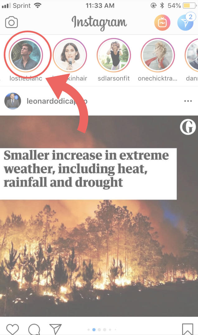Person standing in a forest holding a phone displaying an Instagram story with text "Sprint 11:33 AM @54%", usernames, and information about extreme weather changes.