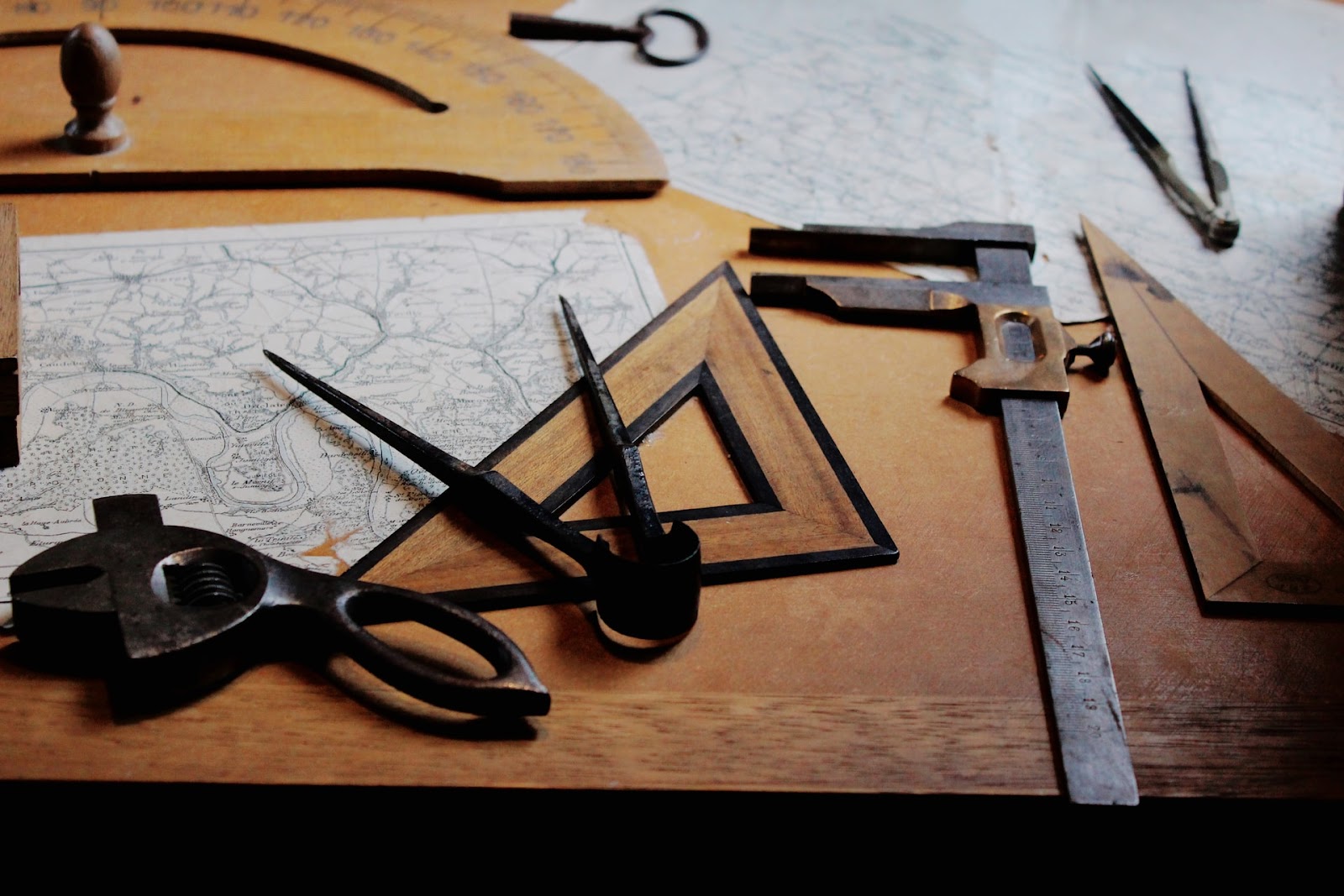 Wooden saw cutting through numbers 11 to 19 with vision care tools like scissors, font in the background.